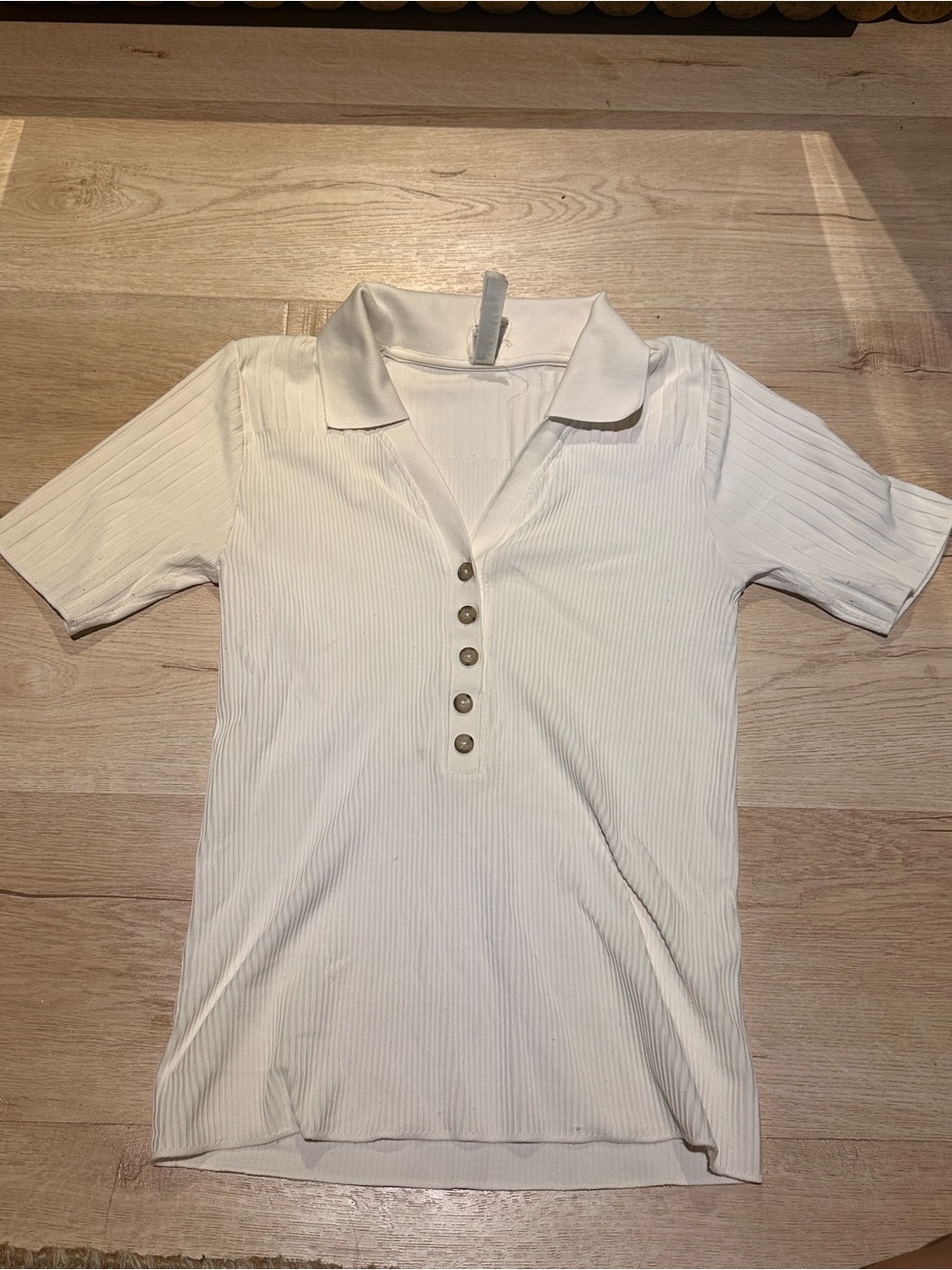 Athleta white ribbed polo shirt with pearl buttons